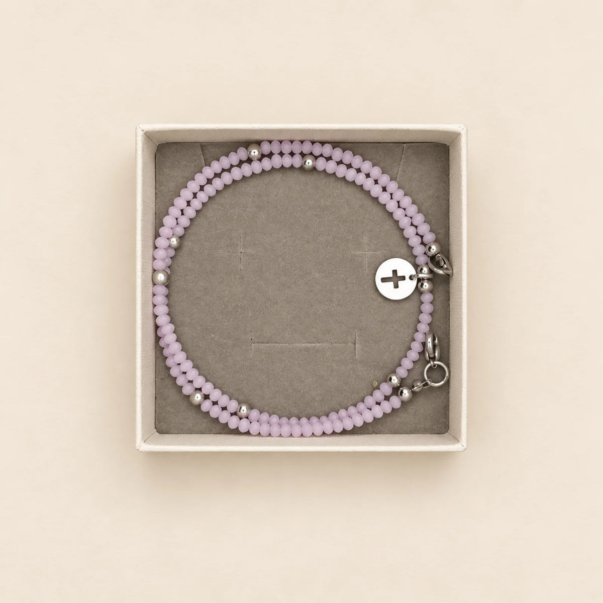 Pulsera gris con cruz
