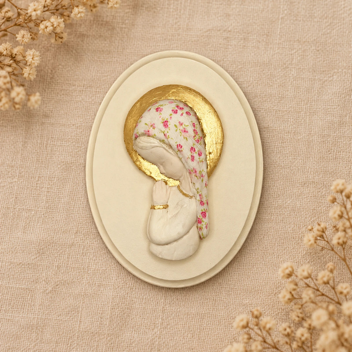 Placa oval con figura religiosa