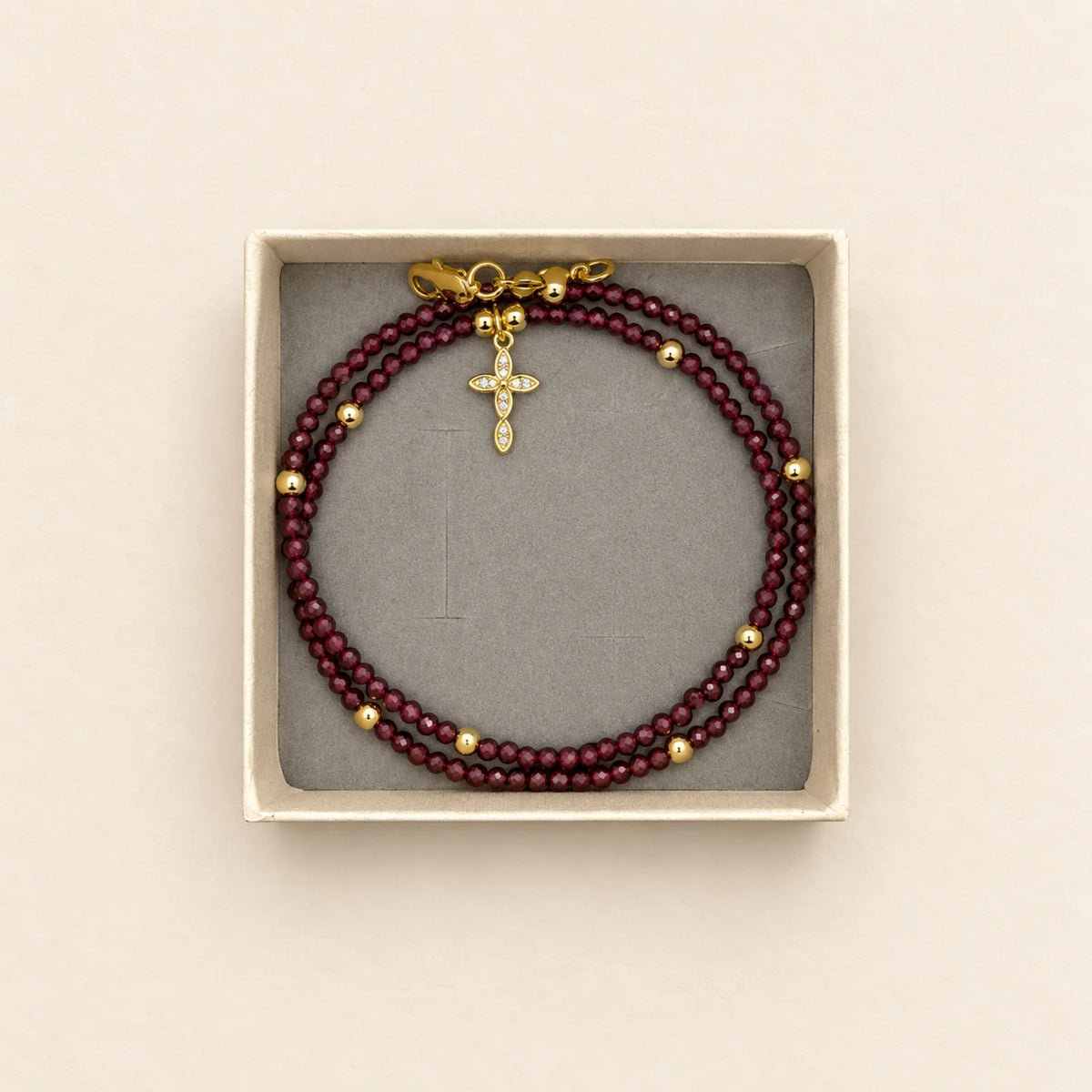 Pulsera bordó con cruz